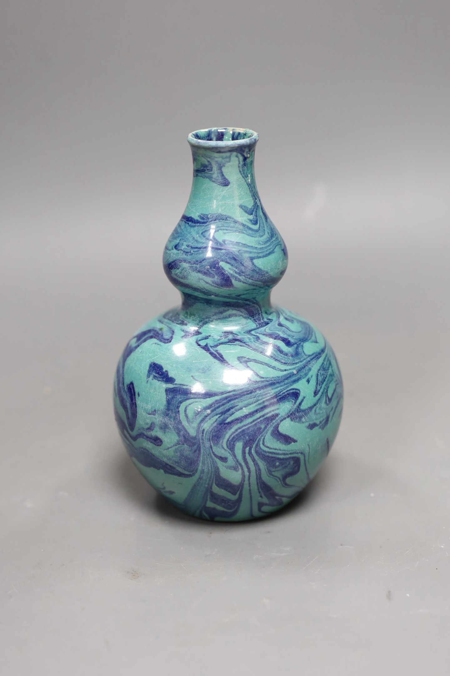 A Chinese double-gourd vase, 17cms